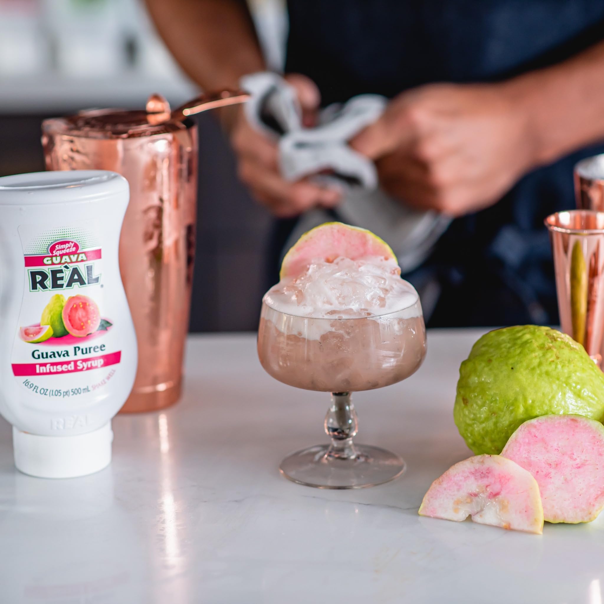 Close-up stream of Reàl Infused Exotics guava syrup texture, showing smooth consistency for recipes