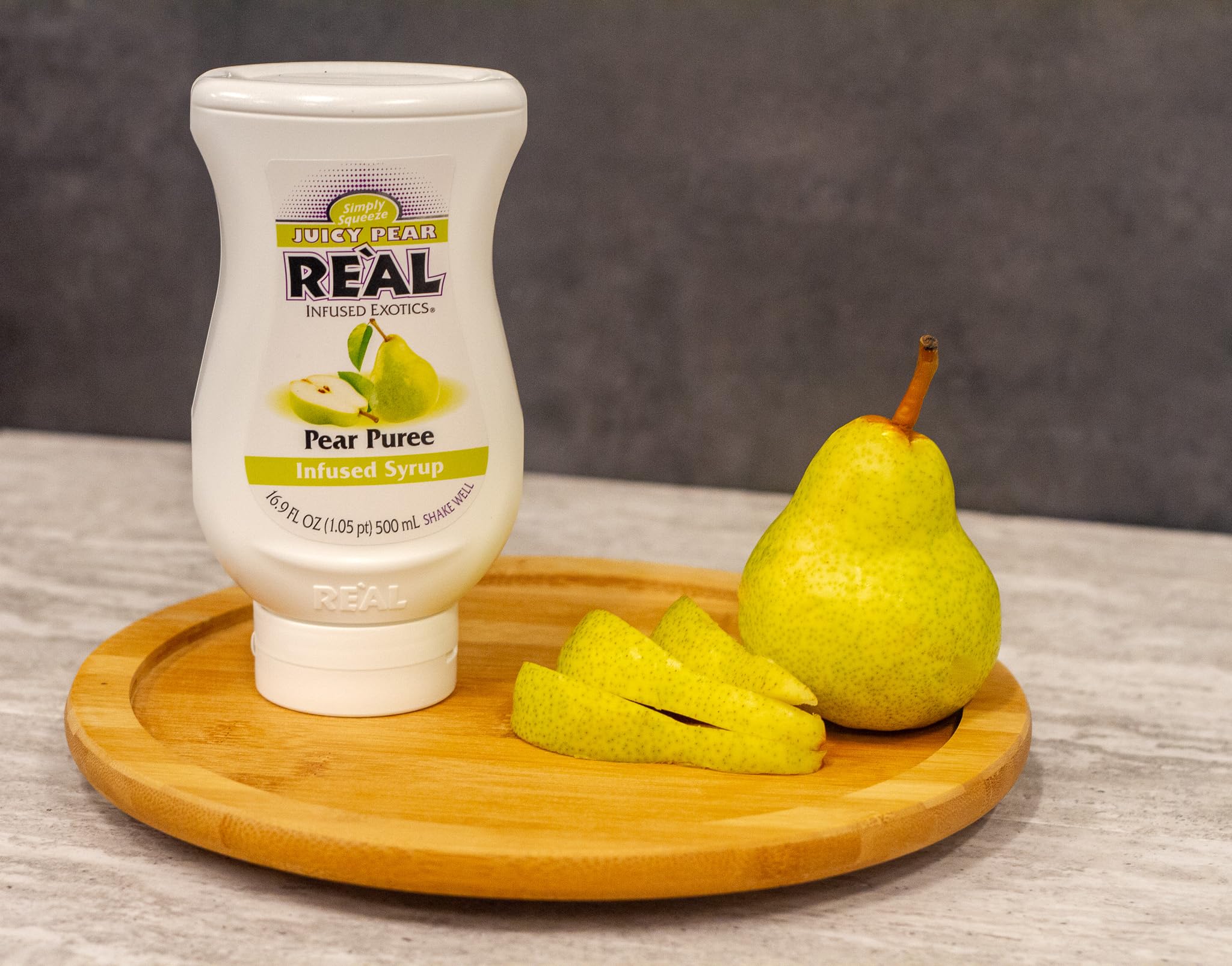 Reàl Infused Exotics drizzled over dessert to show culinary use and consistent pear flavor benefit