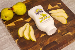 Reàl Infused Exotics used in a pear cocktail, illustrating quick incorporation and bright aroma benefit
