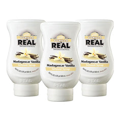 Reàl Infused Exotics front packaging showing three 16.9 fl oz bottles and clear label benefit