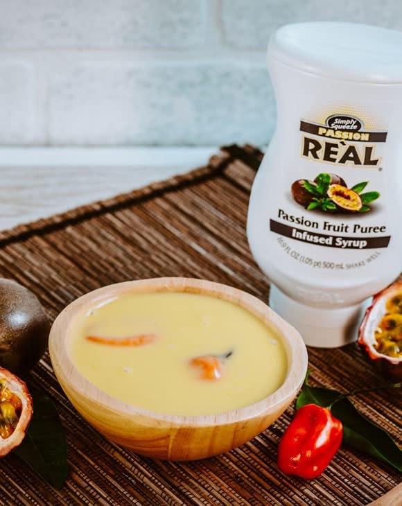 Reàl Infused Exotics used in a cocktail glass to illustrate bright tropical flavor enhancement