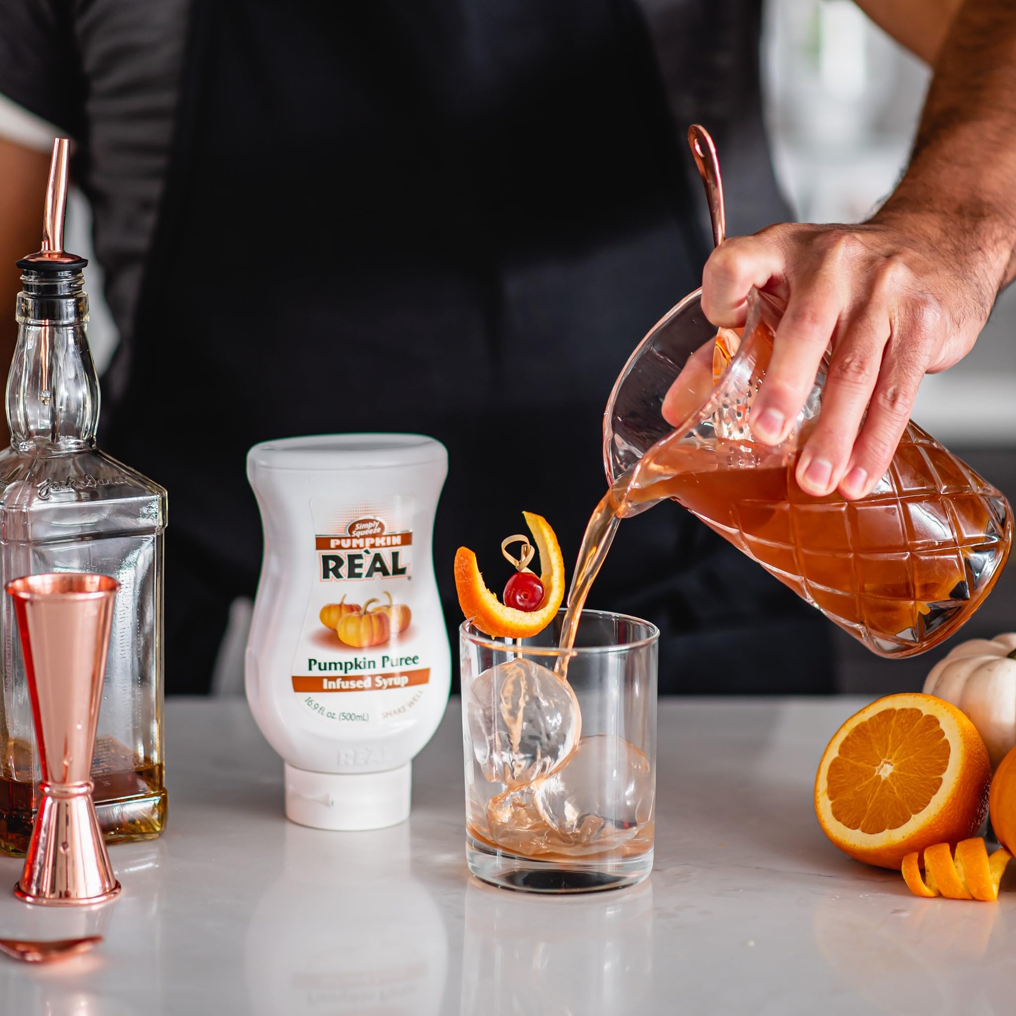 Reàl Infused Exotics three-pack staged in a cozy autumn kitchen setting for seasonal prep