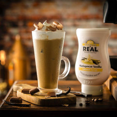 Reàl Infused Exotics wide-mouth bottle top emphasizing easy spoon access