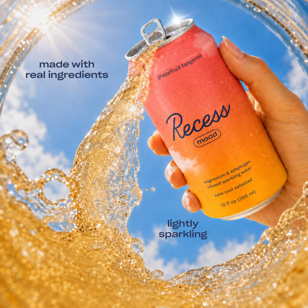 Recess pouring into glass with visible bubbles showing refreshing texture
