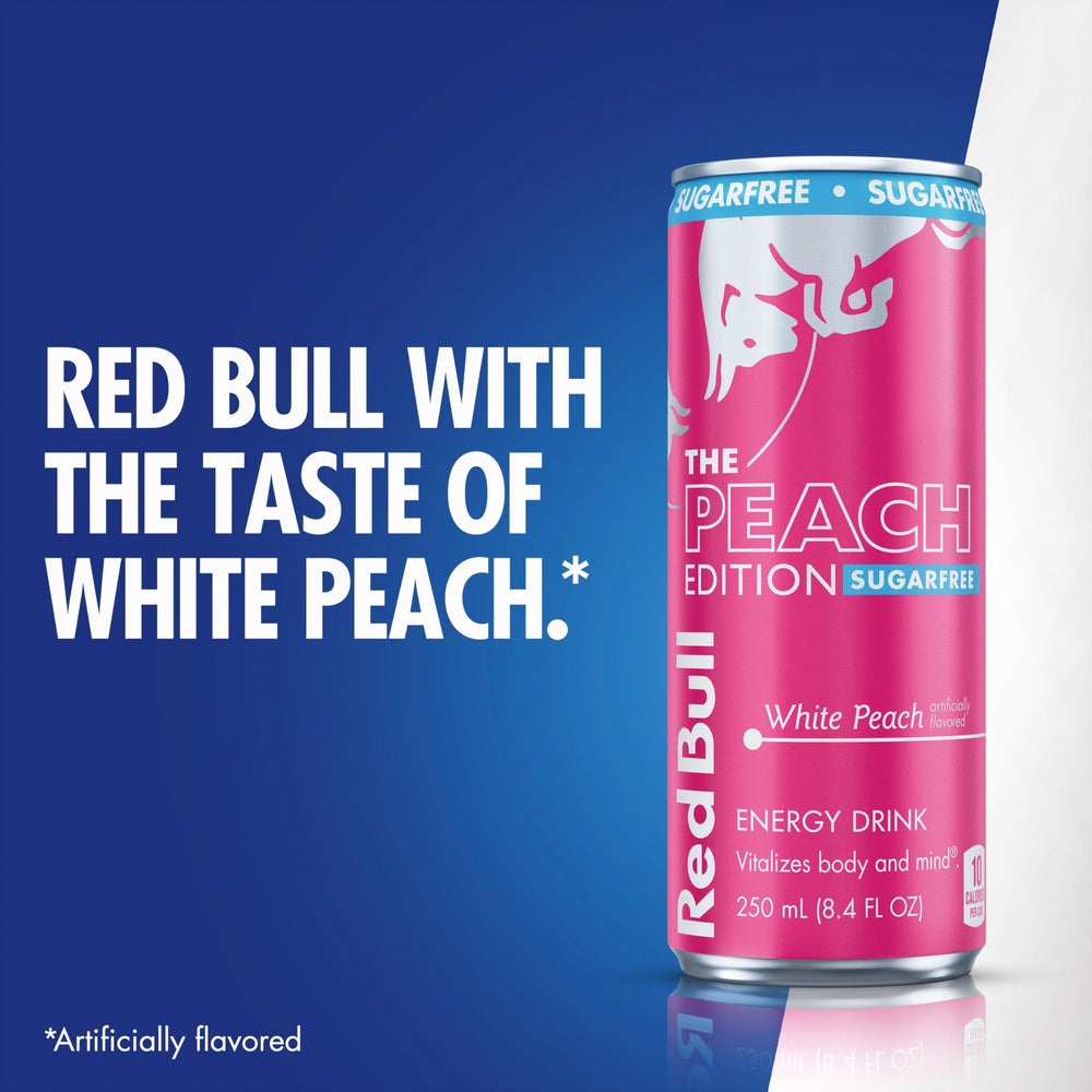 Red Bull White Peach can beside smartphone showing compact size and travel benefit