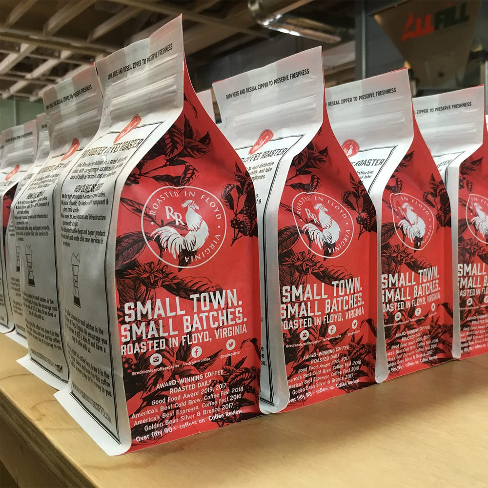 Red Rooster Coffee roasting room small-batch bags lined up showing craft roast care