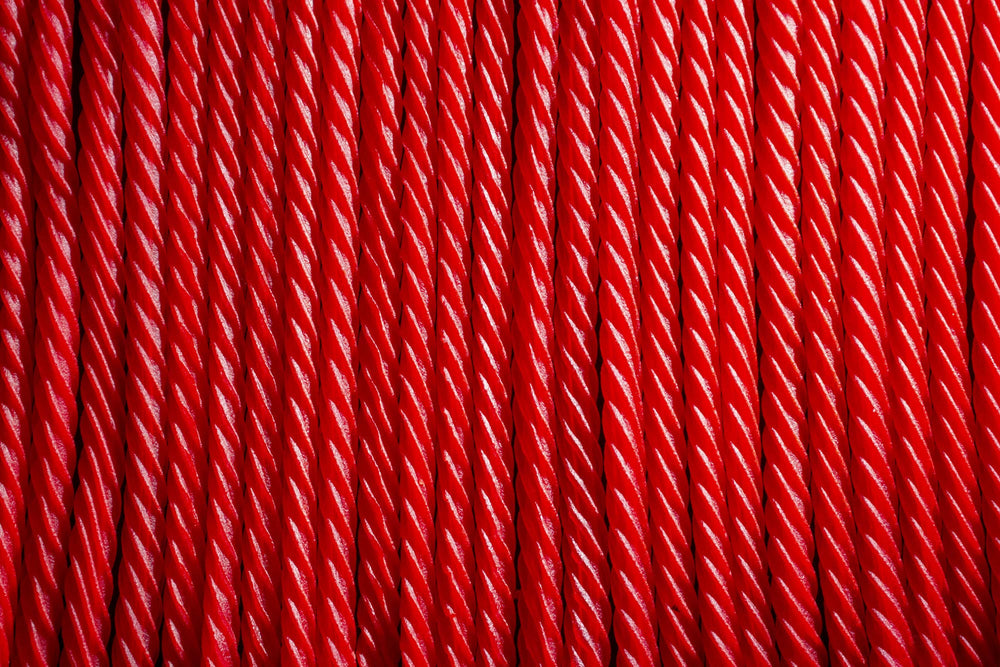 Red Vines close-up of twist texture highlighting soft chew and rich color