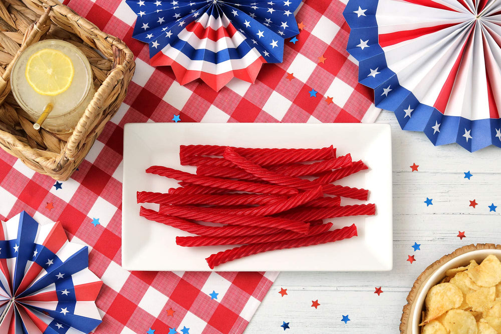 Red Vines twist in hand demonstrating size and chewability for portioning