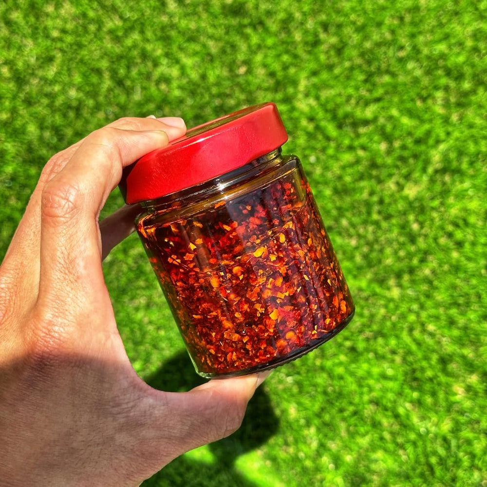 Redbloom chili crisp close-up texture highlighting crunchy bits and savory appeal