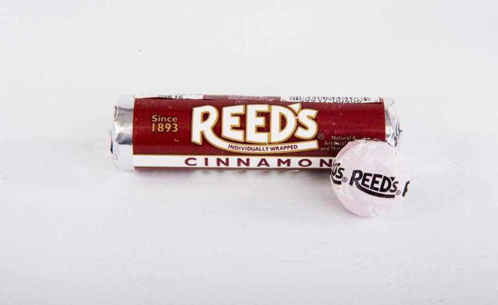 Close-up of a Reed's cinnamon roll wrapper and texture highlighting fresh, non-sticky packaging