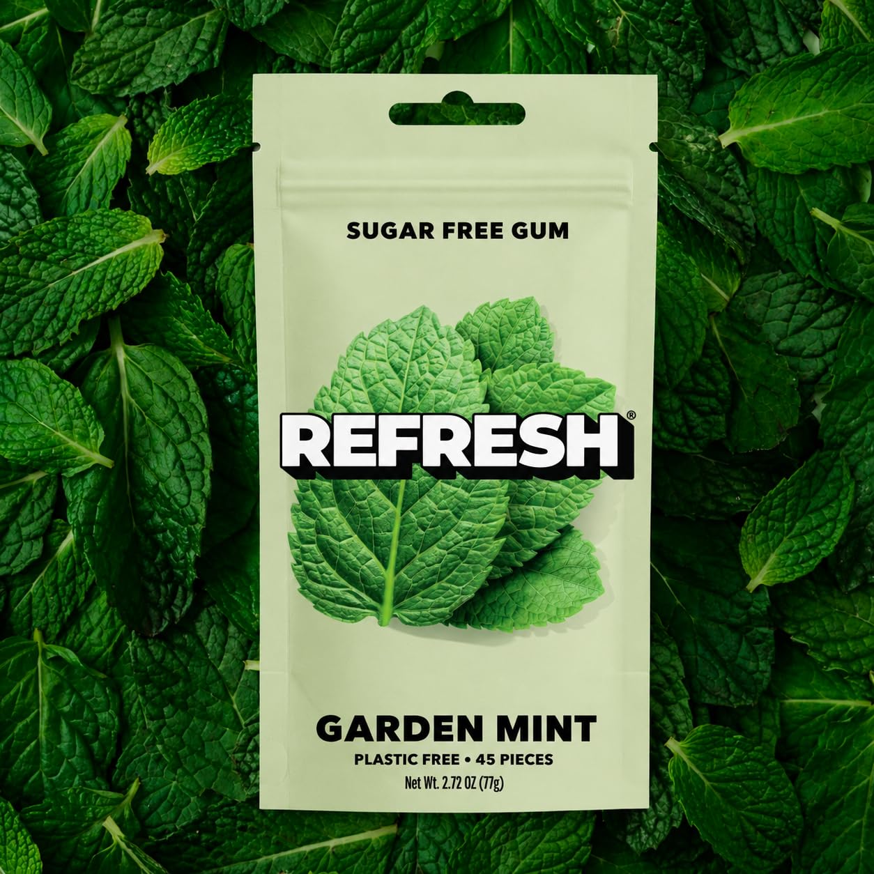 Refresh Gum pouch on a desk near laptop showing convenient everyday use