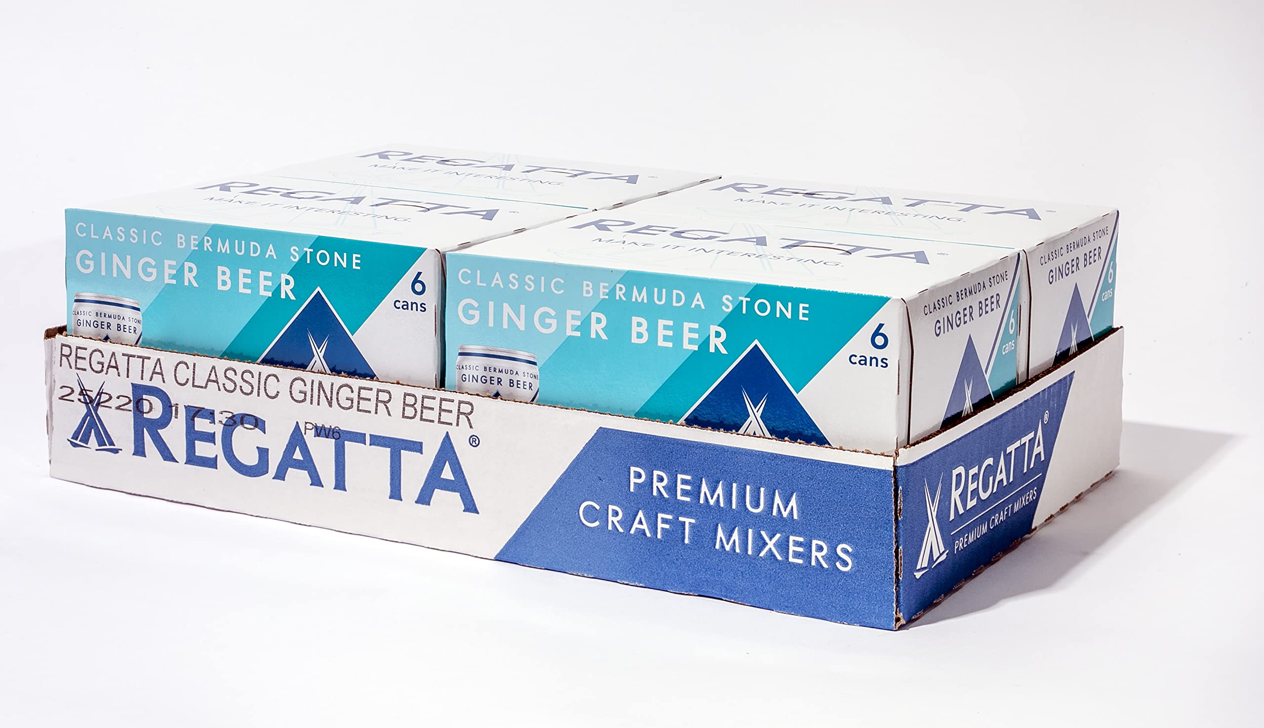 Regatta can beside fresh ginger and lime showing natural flavor sources