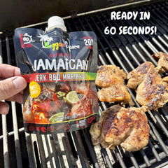 Reggae Spice pouring marinade onto grilled chicken, quick seasoning for juicy results