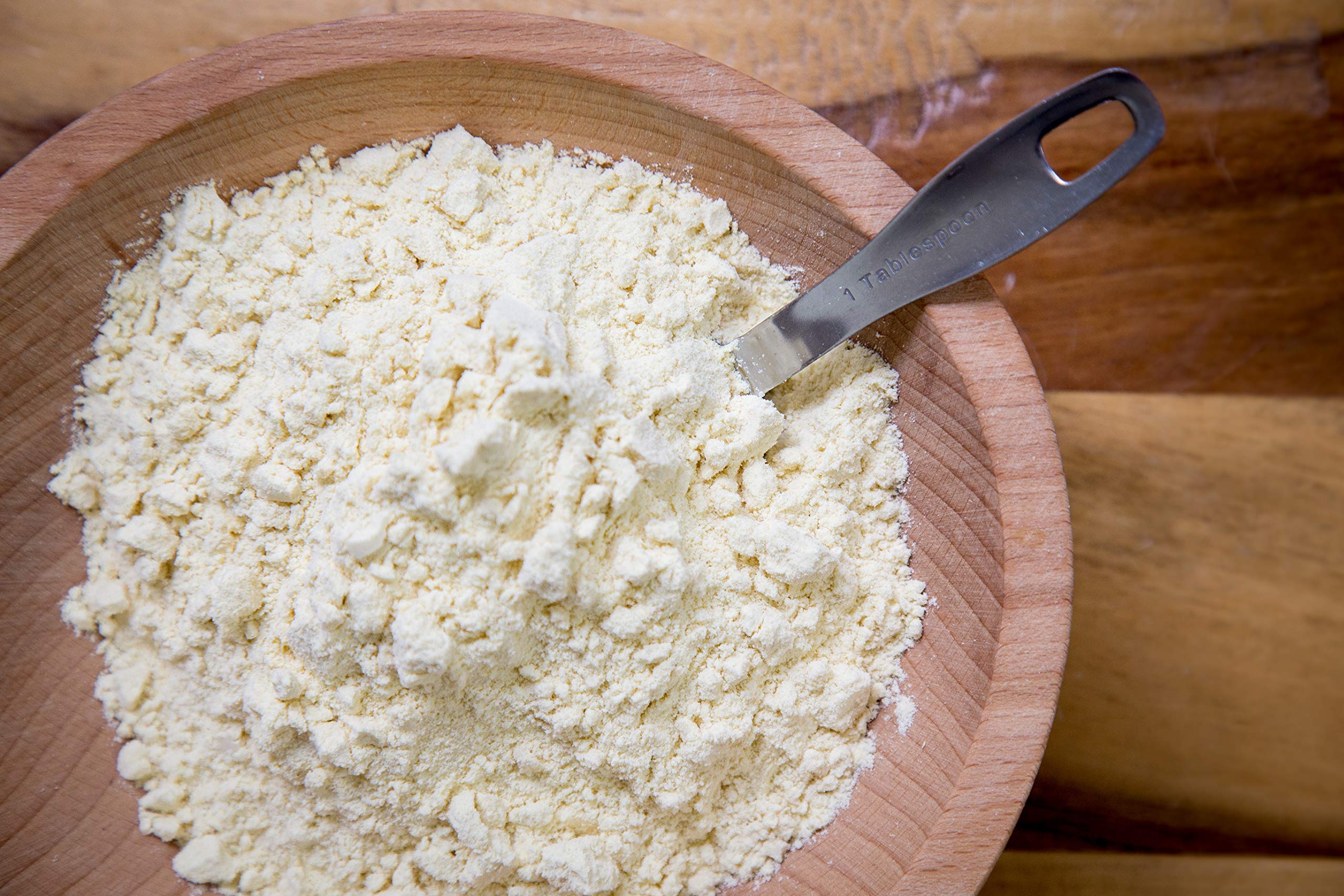 Relative Foods millet flour in bowl with spoon showing mixing convenience