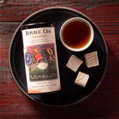 Close-up of The Republic of Tea chai teabag material and tag, highlighting fast steeping and convenient use