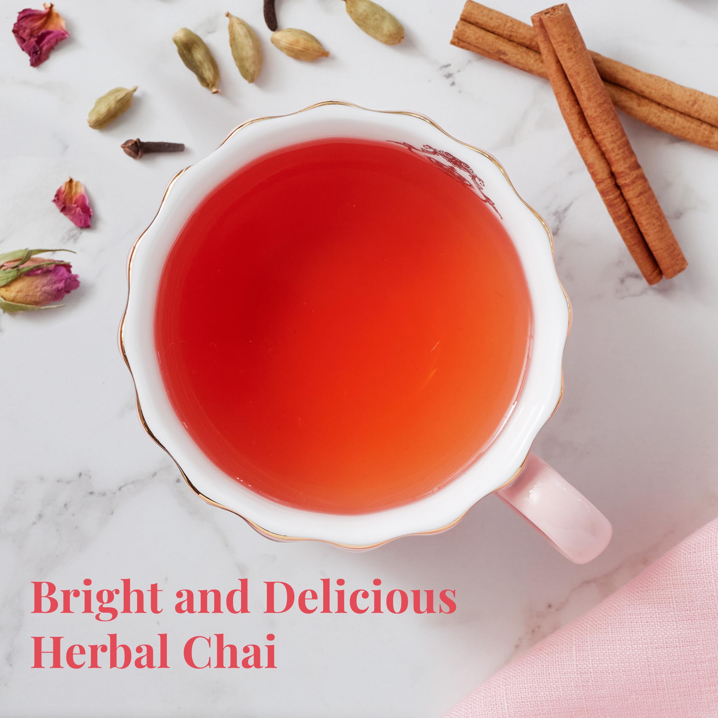 Steaming mug of Republic of Tea pink chai in hand showcasing comforting, caffeine-free warmth