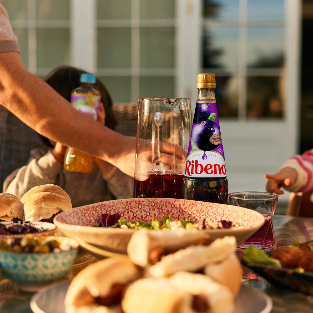 Ribena reduced to a glossy glaze on dessert adding bold berry flavor