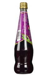 Ribena pouring into glass demonstrating simple serving and vibrant color