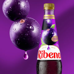 Ribena concentrate mixed with sparkling water creating fizzy refreshment