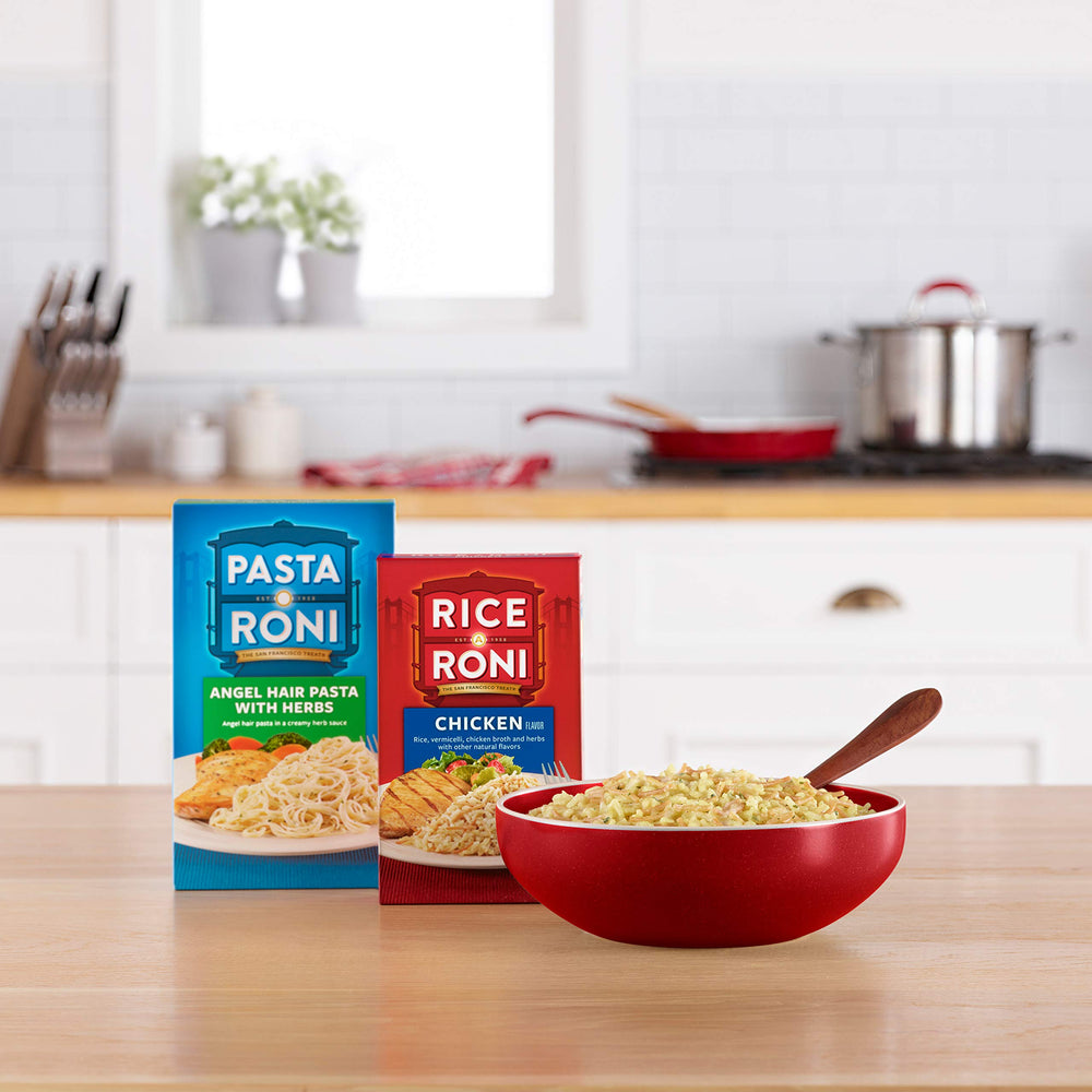 Rice-A-Roni box beside measuring cup showing brand and easy portioning