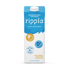 Ripple milk being poured into a glass highlighting creamy texture and smooth pour
