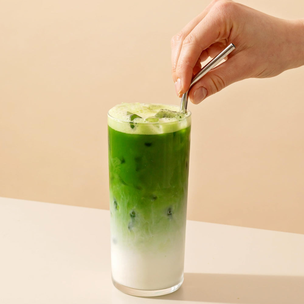 Rishi Tea open tin with bright green powder showing easy scoopability