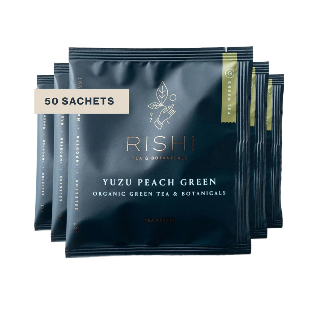 Rishi Tea front packaging showing Yuzu Peach Green 50-count sachets and organic seal, clear labeling benefit
