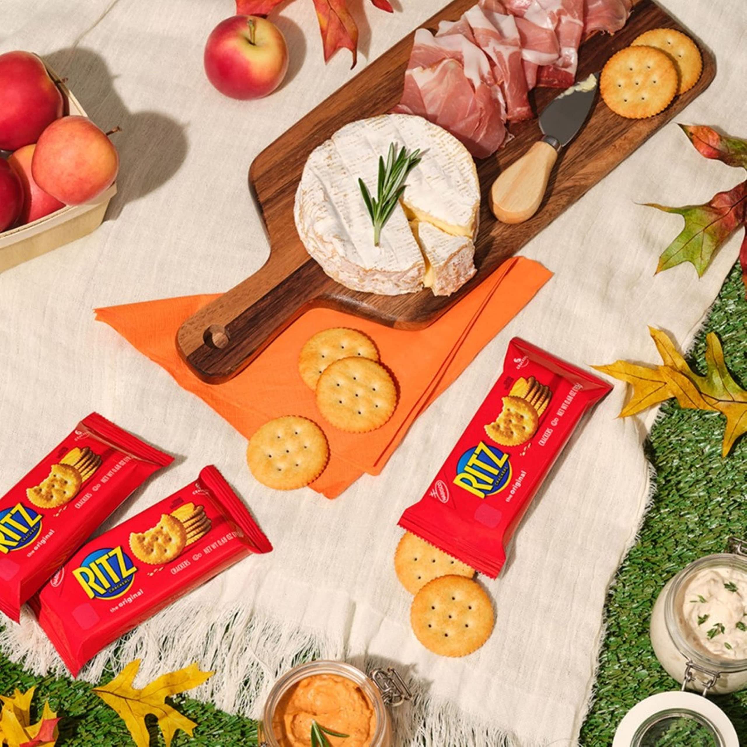 RITZ crackers stacked by hand showing size and portion for sharing