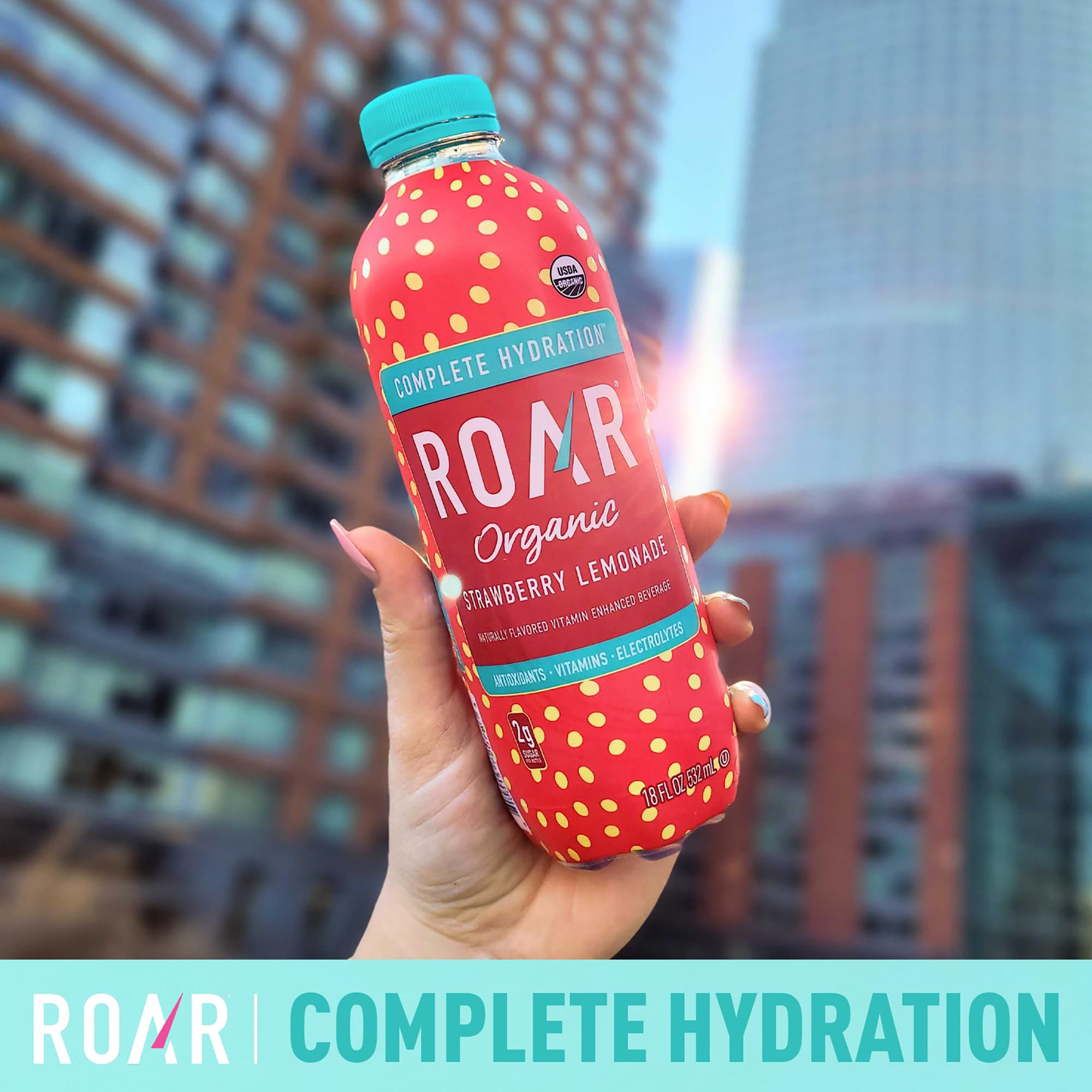 ROAR bottle held in hand to show scale and easy portability for active use