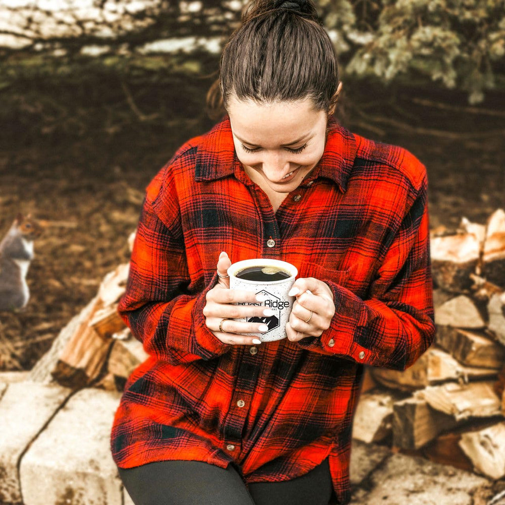 Roast Ridge coffee pods staged at outdoor breakfast showcasing portability