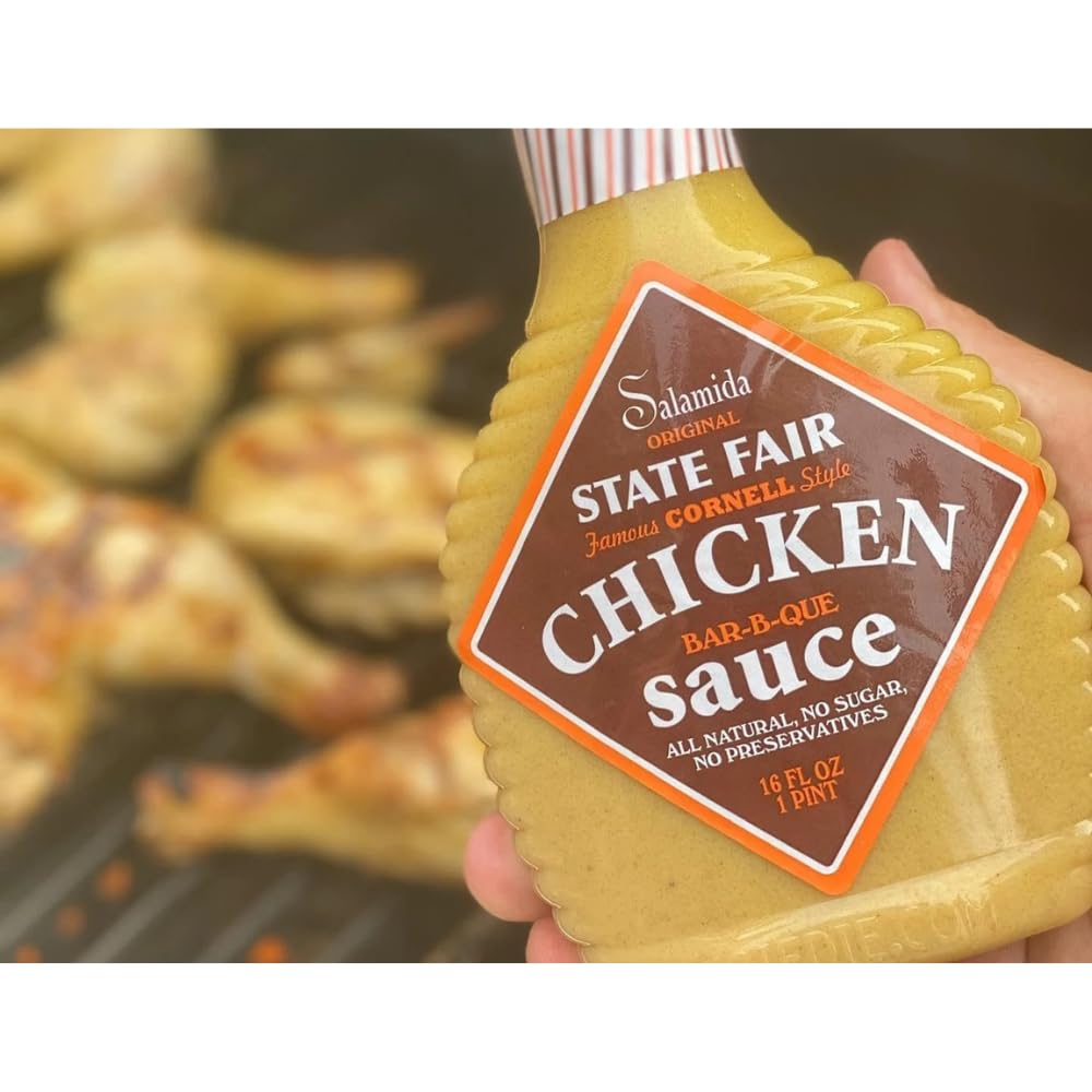 Rob Salamida pouring marinade onto raw chicken, demonstrates easy application for tenderizing