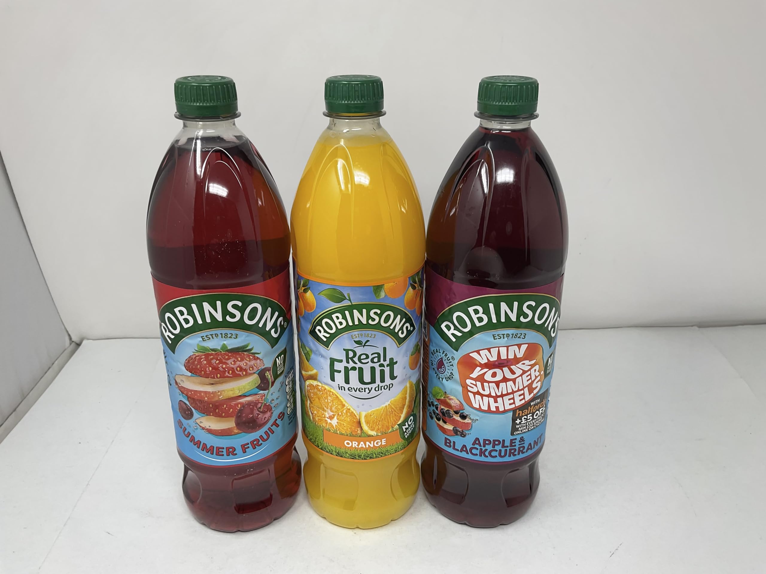 Robinsons apple and blackcurrant being poured into a glass offering fruity refreshment