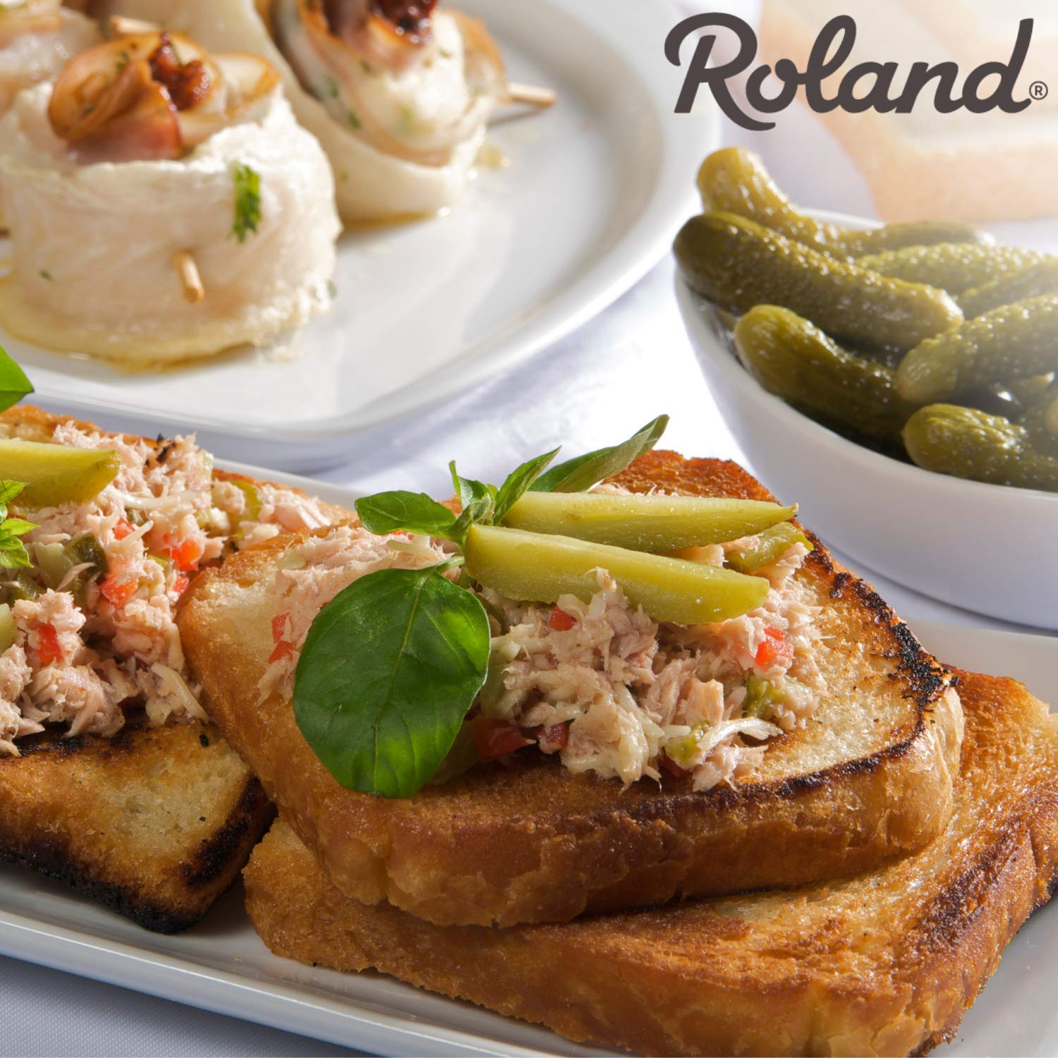 Roland Foods cornichons on charcuterie plate enhancing rich cheeses and meats