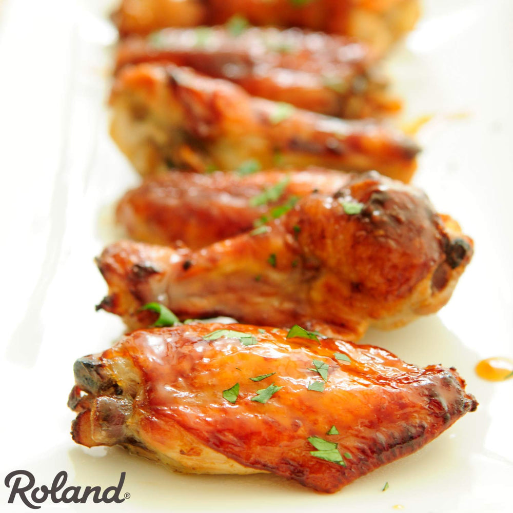 Roland Foods bottle on kitchen counter ready for high-volume cooking and fast plating