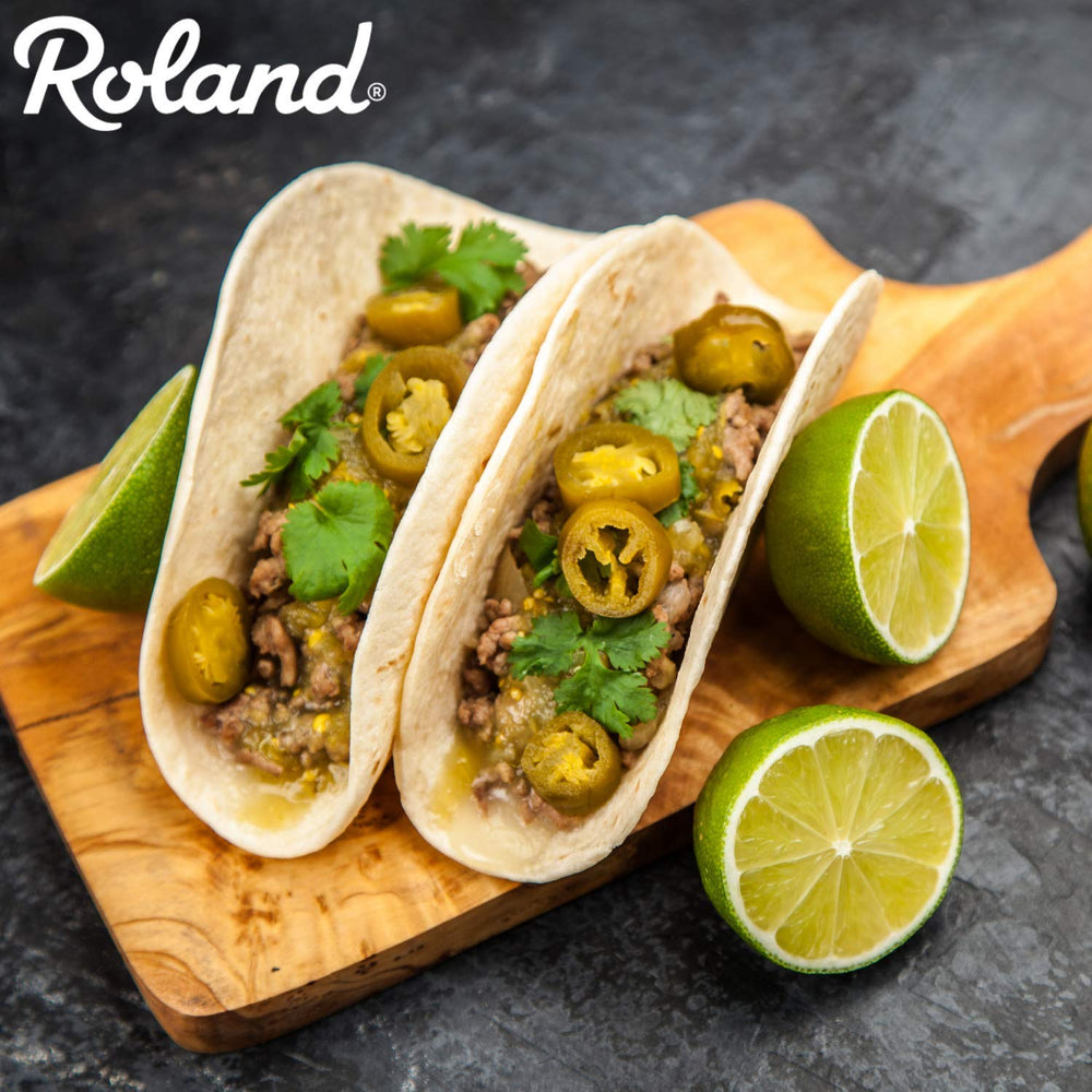 Roland Foods jar held in hand for scale showing bulk size convenience