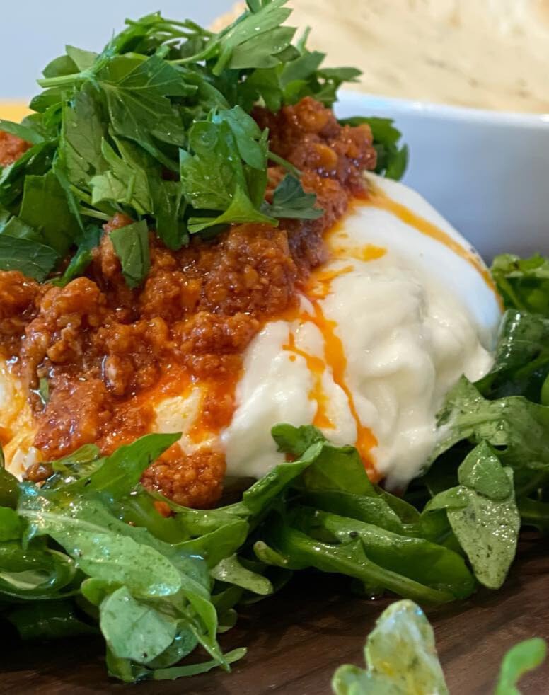 Ronda's Fine Foods bowl of romesco on charcuterie board elevating appetizers and entertaining