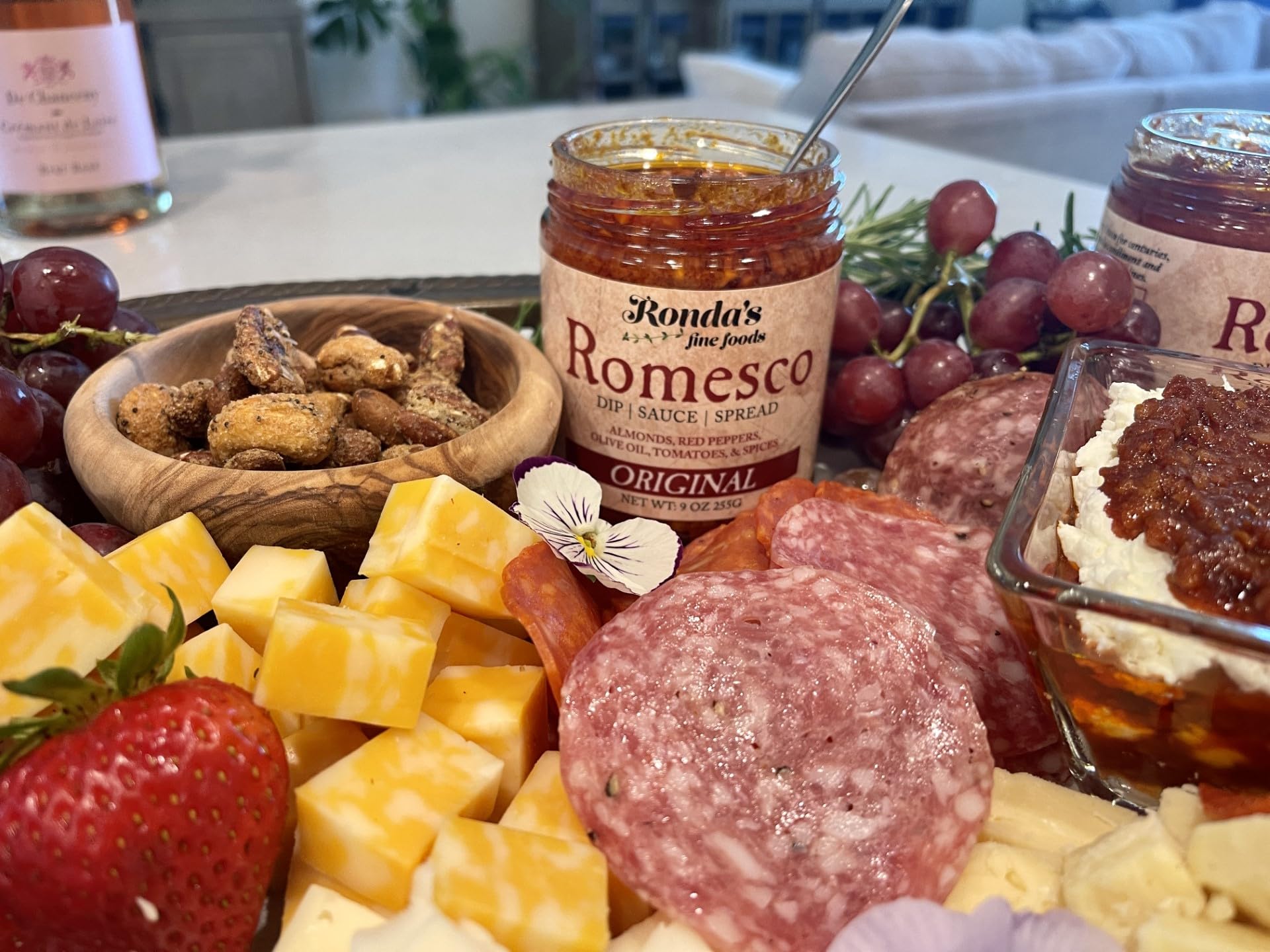 Ronda's Fine Foods almonds peppers and tomatoes flatlay showing fresh ingredient quality