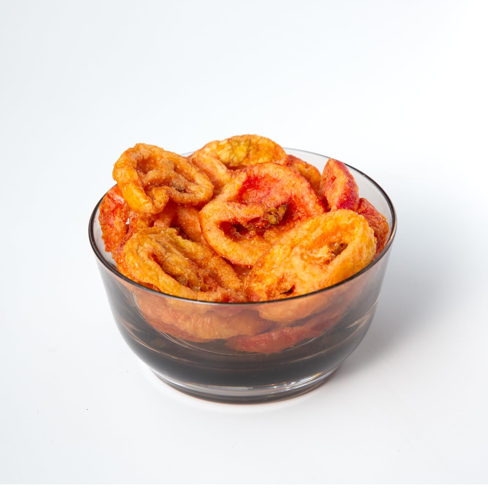 root brand close-up texture of a tomato chip highlighting crunchy, light crispness