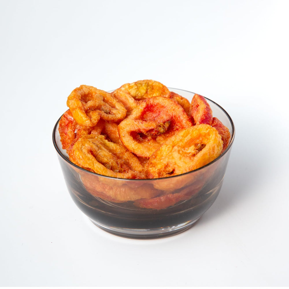 root brand close-up texture of a tomato chip highlighting crunchy, light crispness