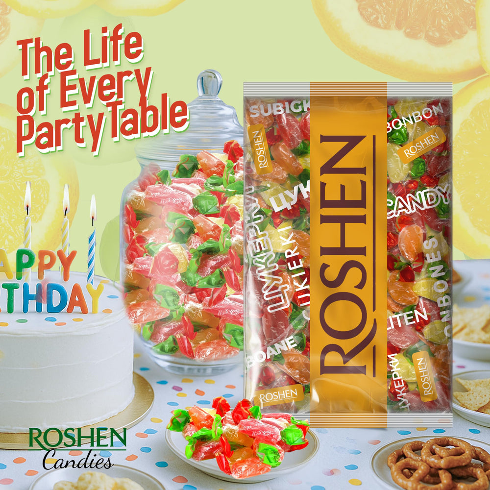Roshen candy in hand next to ruler, shows scale and portion size