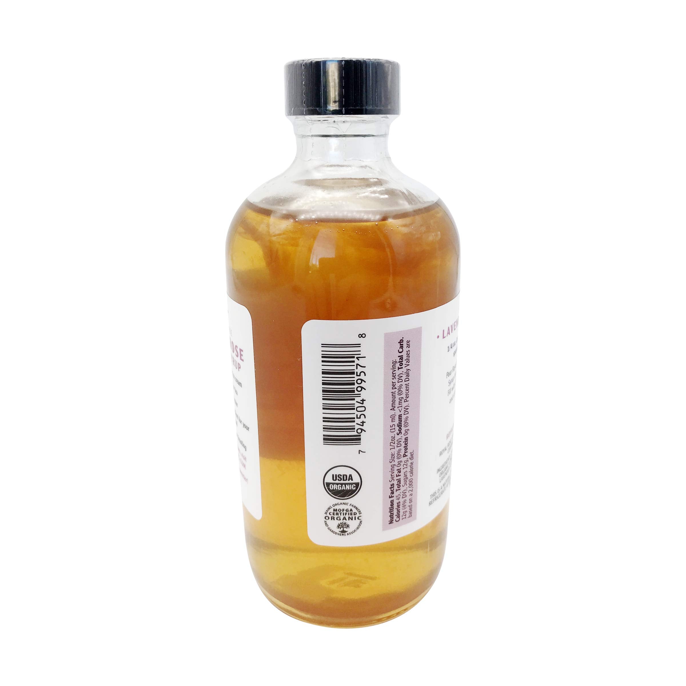 Royal Rose bottle beside lemons and lavender sprigs, displays organic whole ingredients