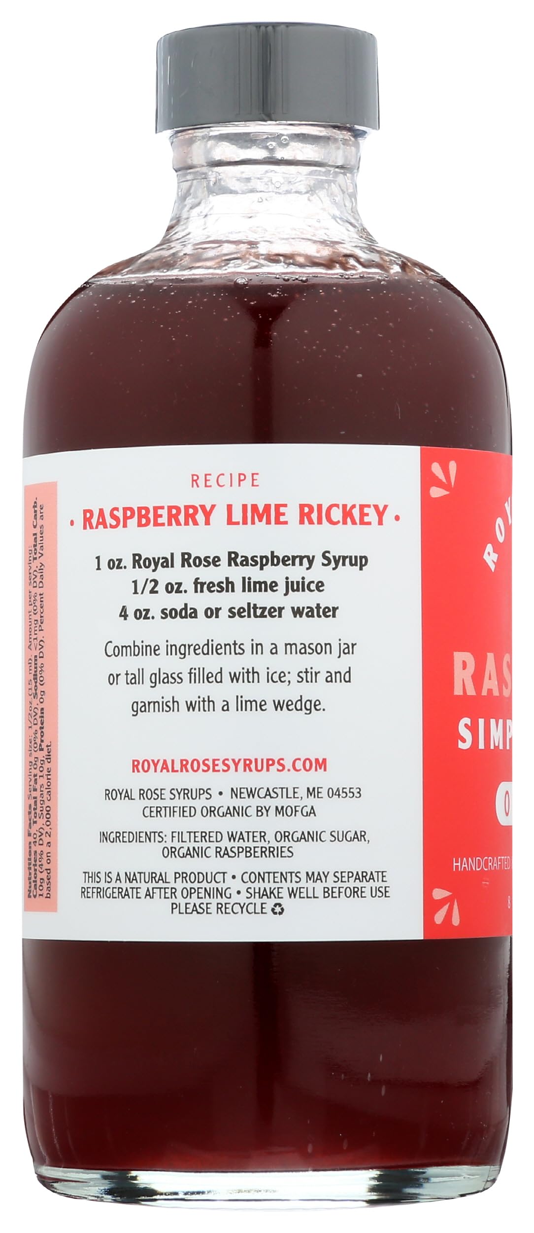 Royal Rose bottle beside raspberries to show size and real fruit content