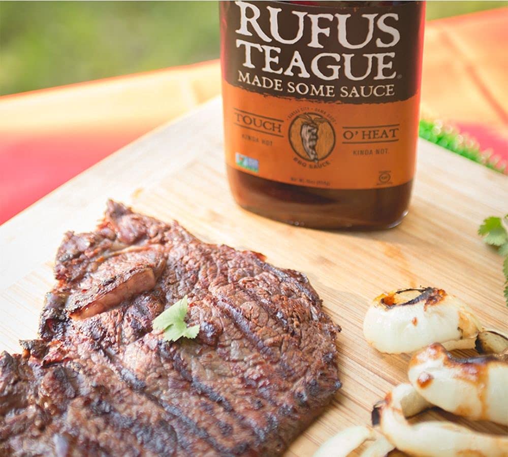 Rufus Teague sauce brushed on ribs creating sticky caramelized finish and flavor