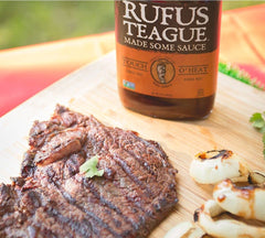 Rufus Teague sauce brushed on ribs creating sticky caramelized finish and flavor