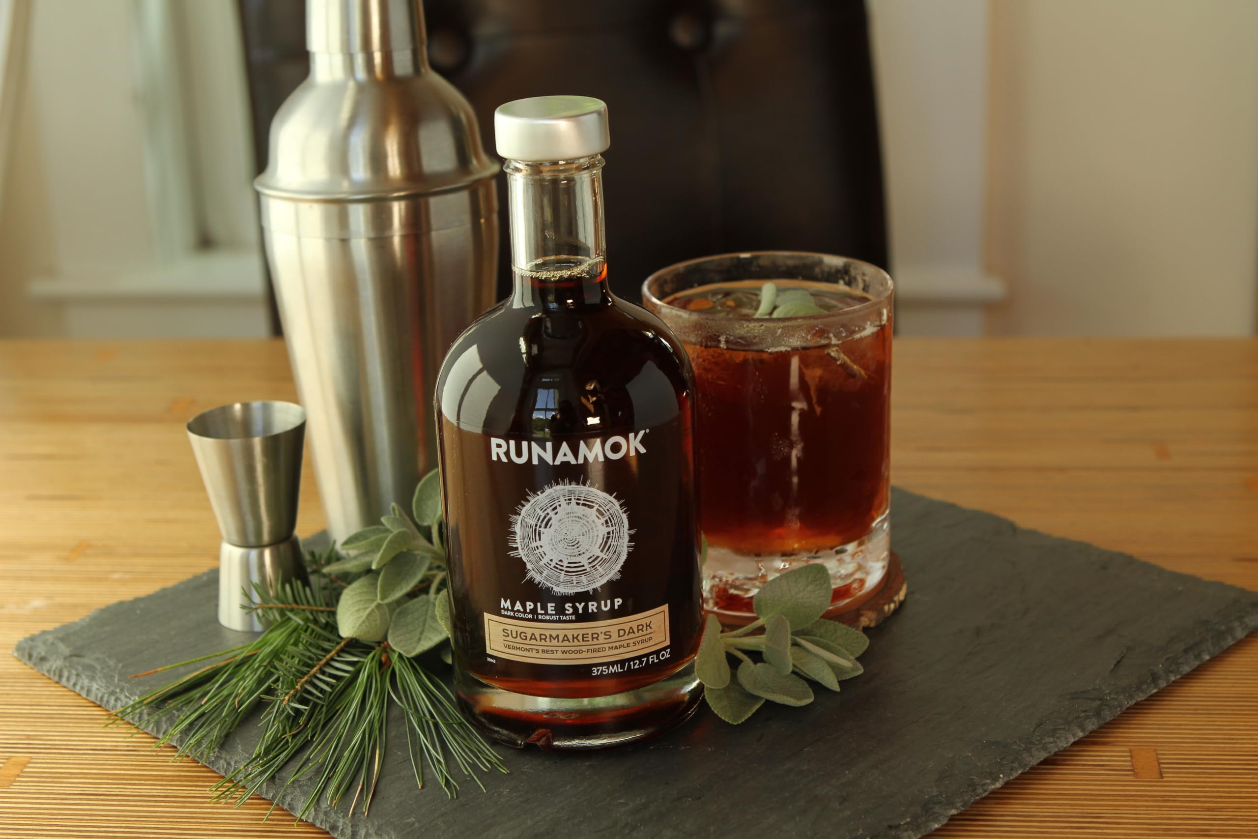 Runamok syrup poured over pancakes in breakfast setting, enhances flavor
