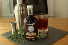Runamok syrup poured over pancakes in breakfast setting, enhances flavor