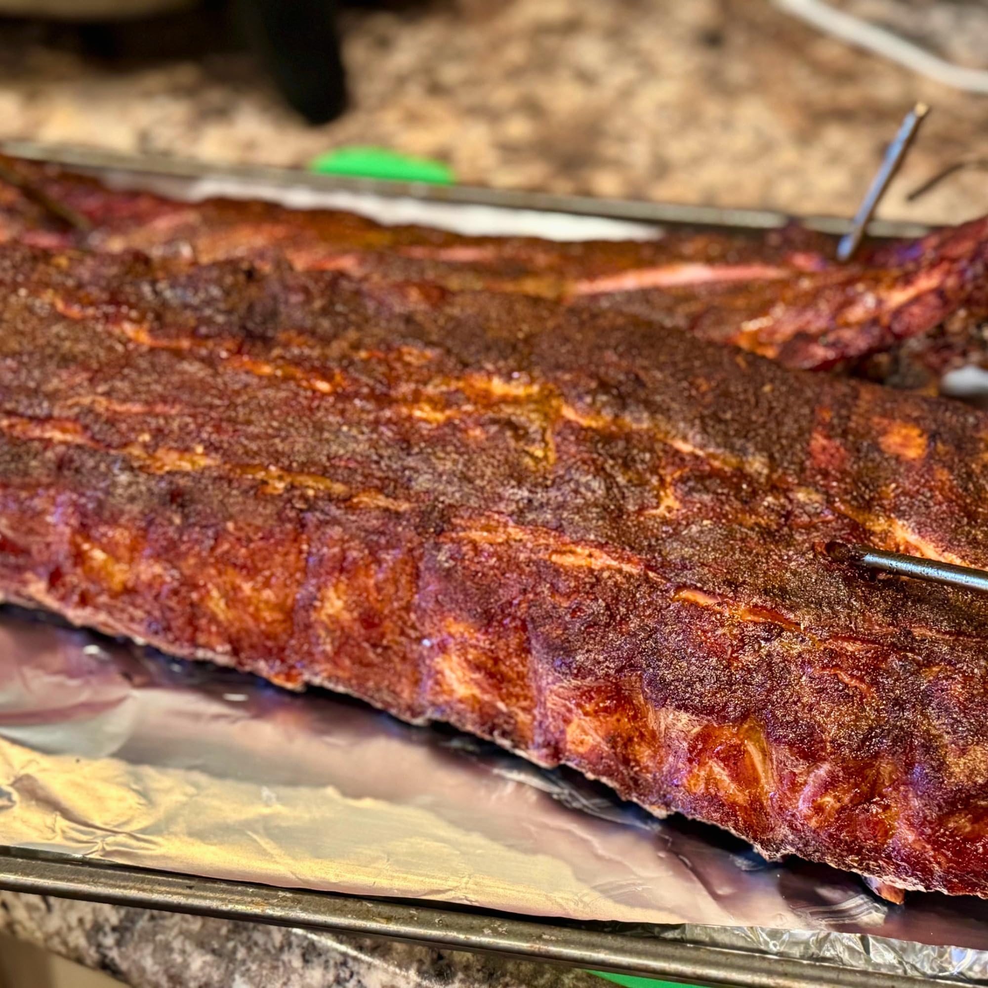 ribs coated in RunninWild peach rub with glossy caramelized crust