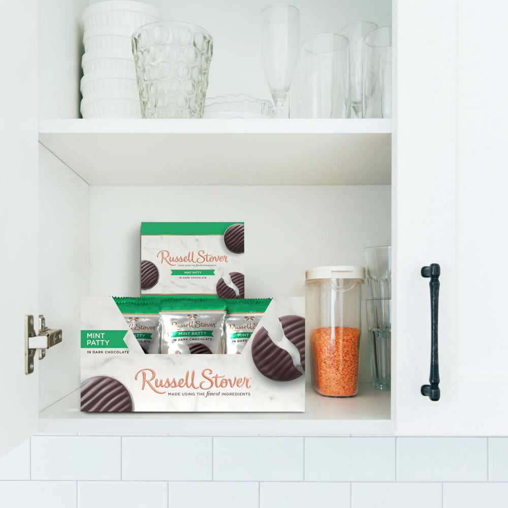 Russell Stover unwrapped patty split open revealing peppermint cream for taste preview