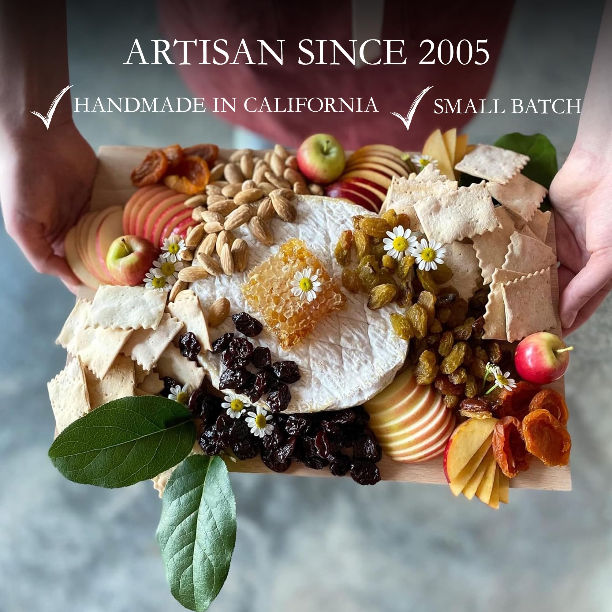 Rustic Bakery single cracker detail with rosemary sprig showing herb infusion