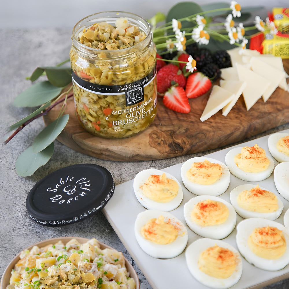 Sable & Rosenfeld raw ingredients display of olives peppers and capers showing quality